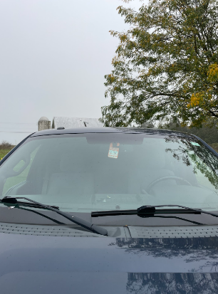 This is a parking permit in a students car  during the school day. This student filled out the information for a permit and brings it to school.